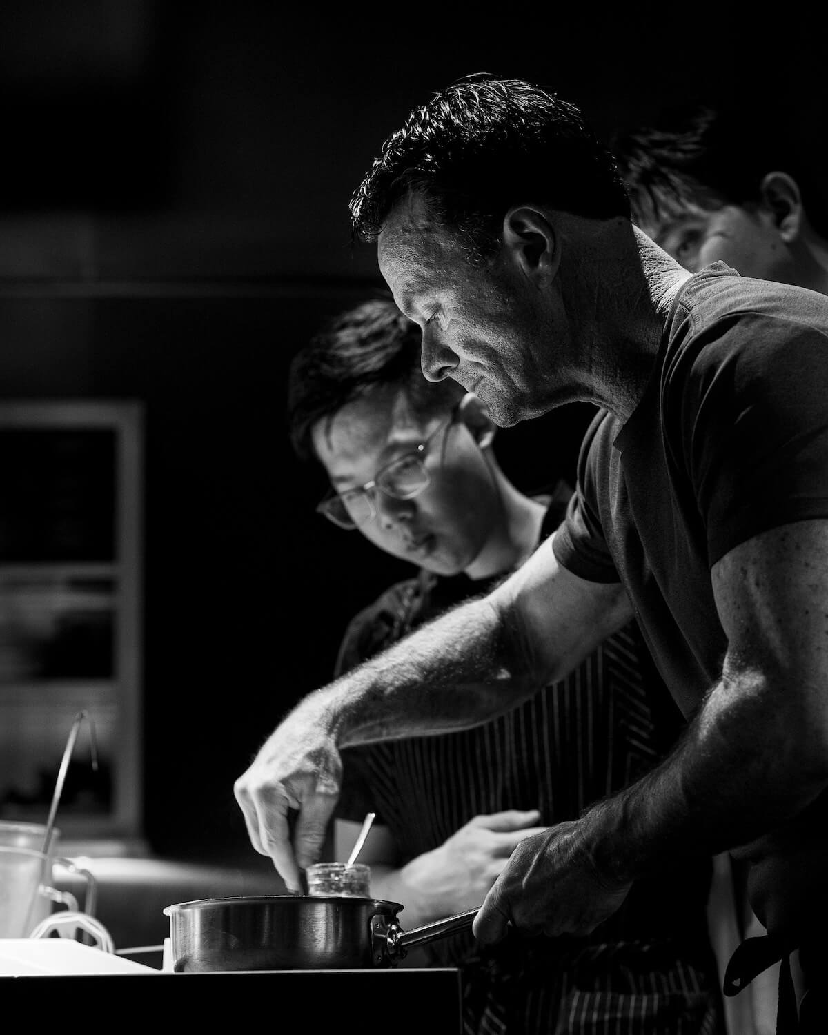 Chef Douglas Keane preparing food in the kitchen